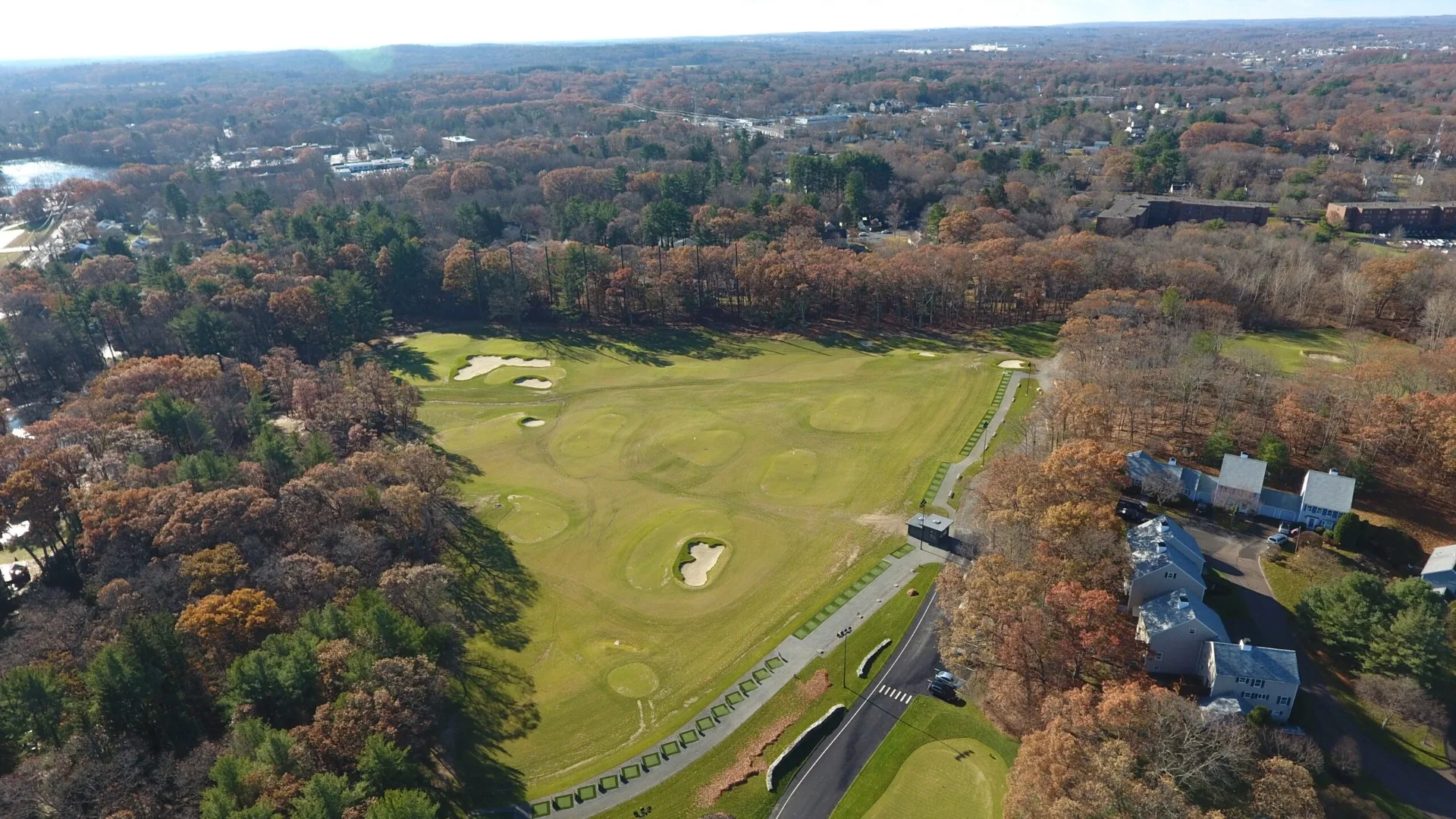 KOHR Golf elite outdoor driving range and target greens at sunset in Natick, MA